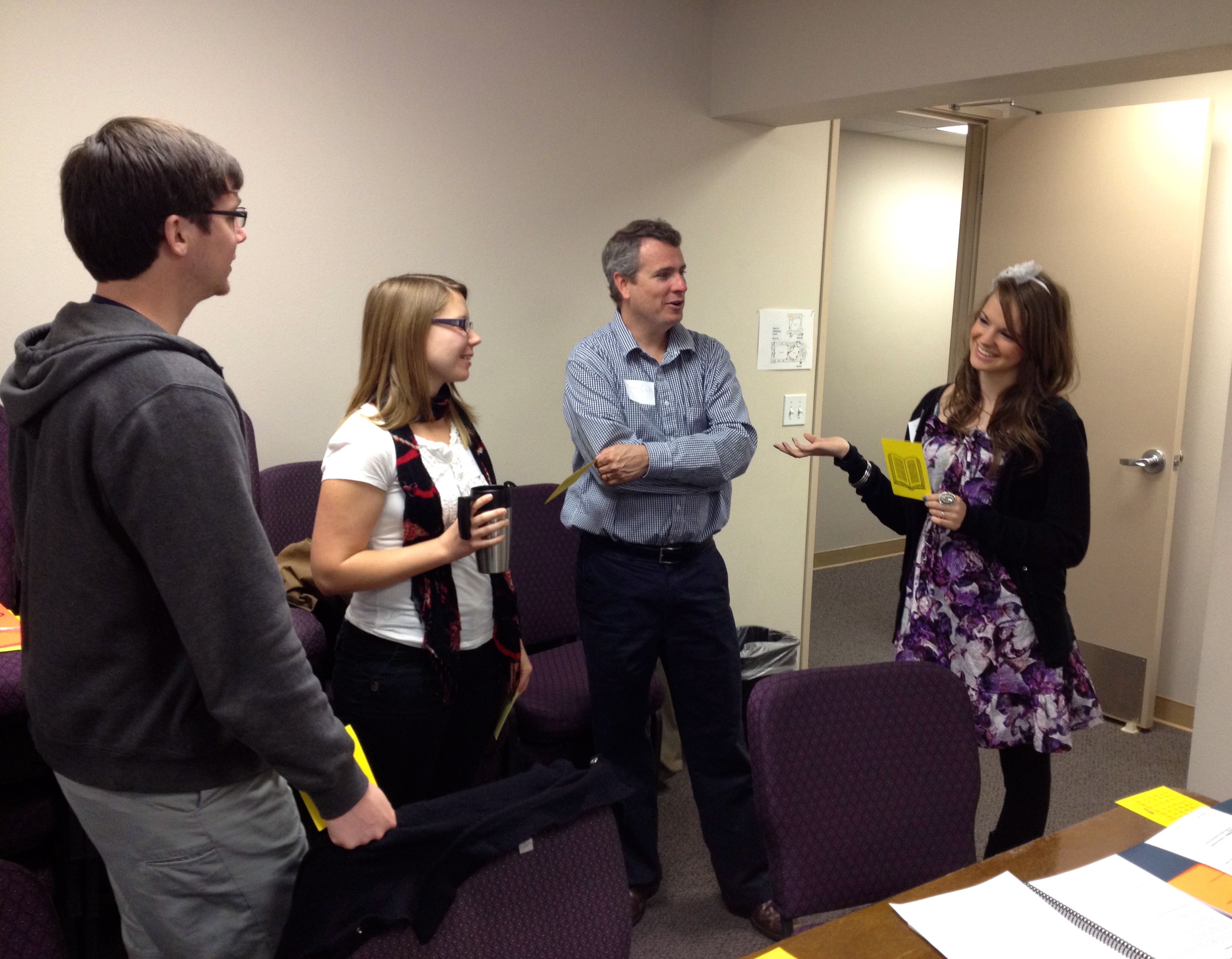 Hannah and Ray practicing teaching with other participants