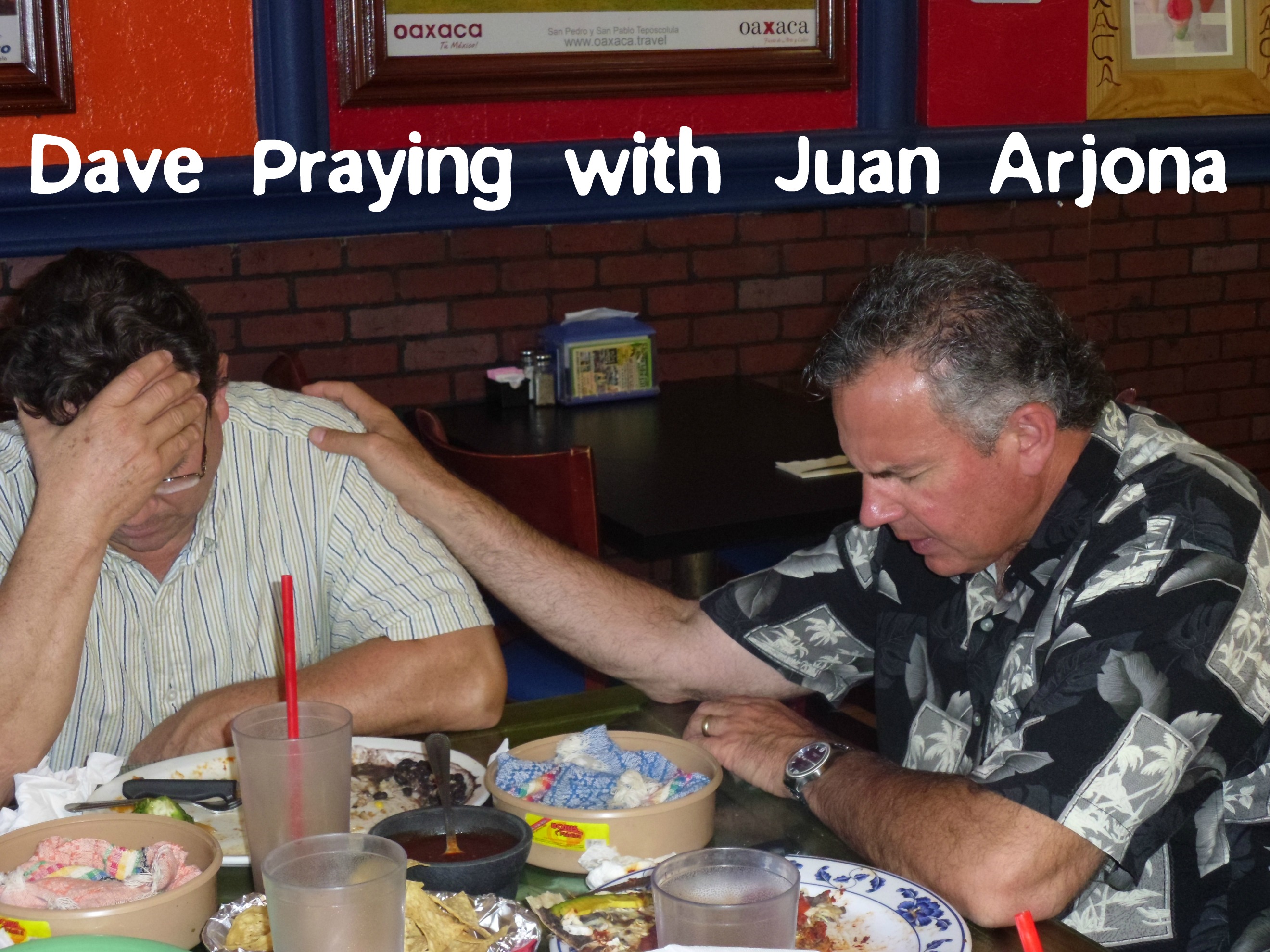Dave praying with Juan Arjona