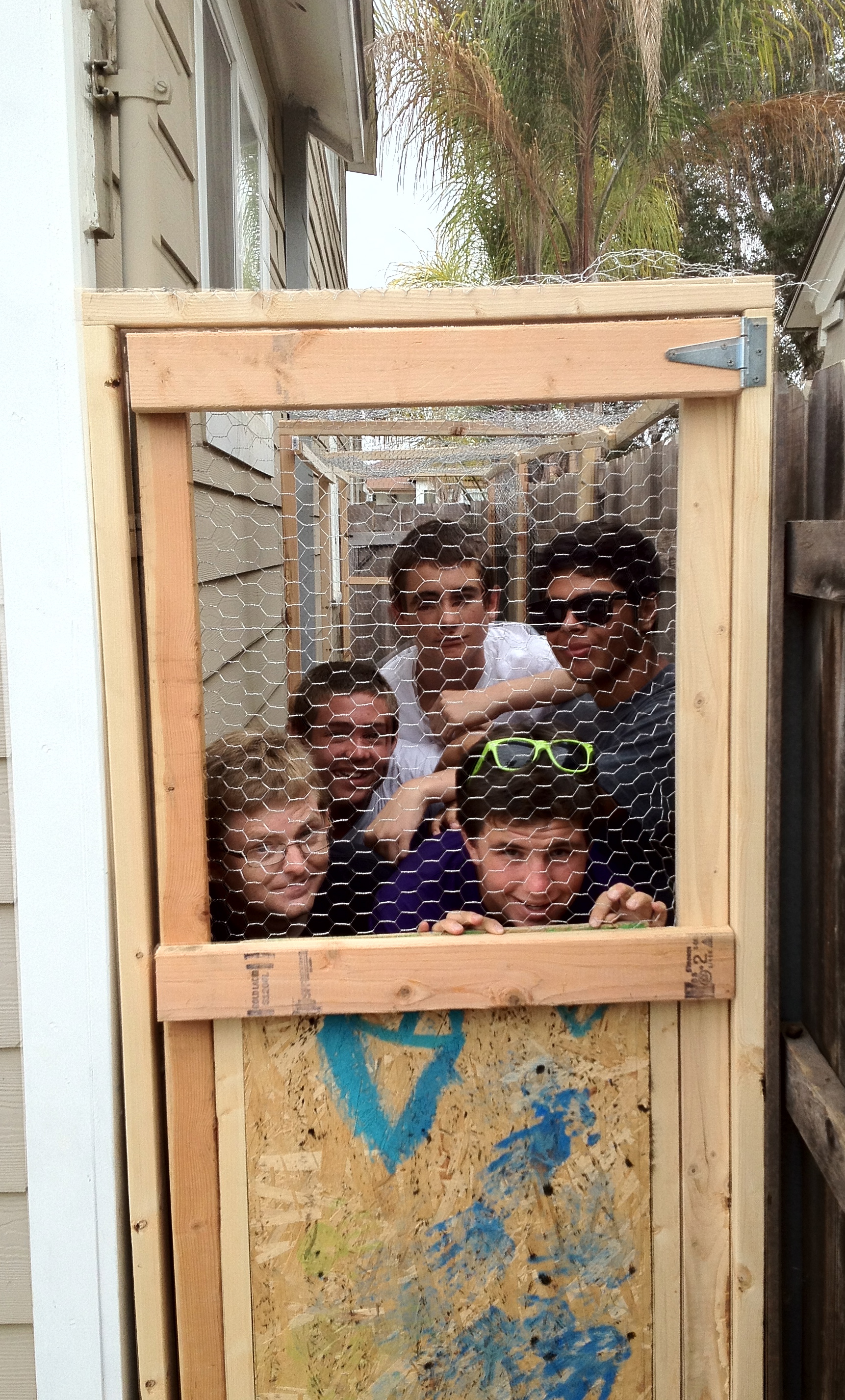 Bob Bjerkaas on the left with his guys in the chicken coop