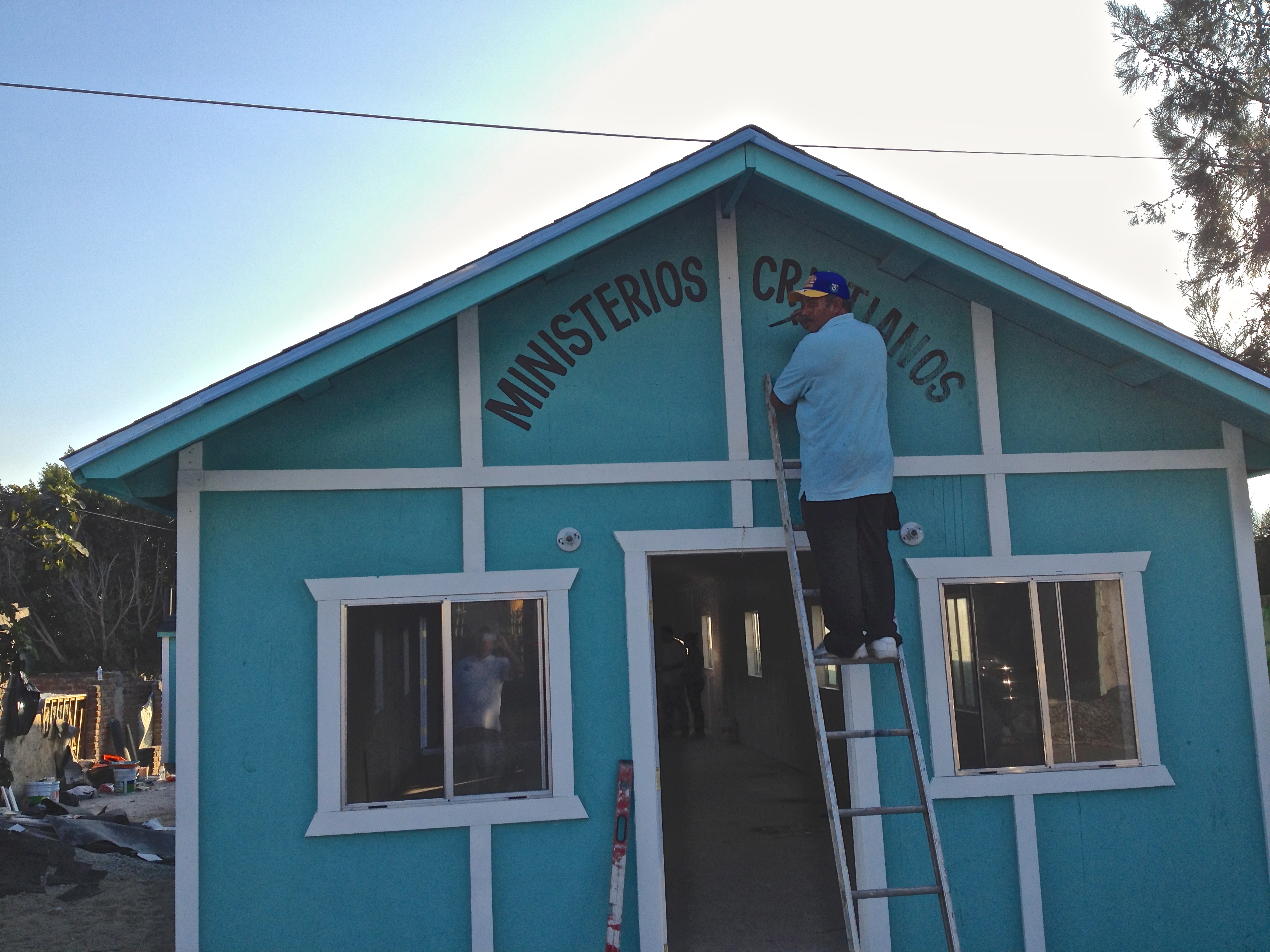 Painting the Sign on the Church