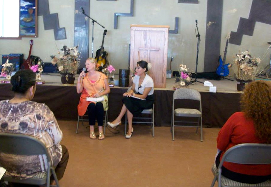 Dawn speaking in front of the women with Martha