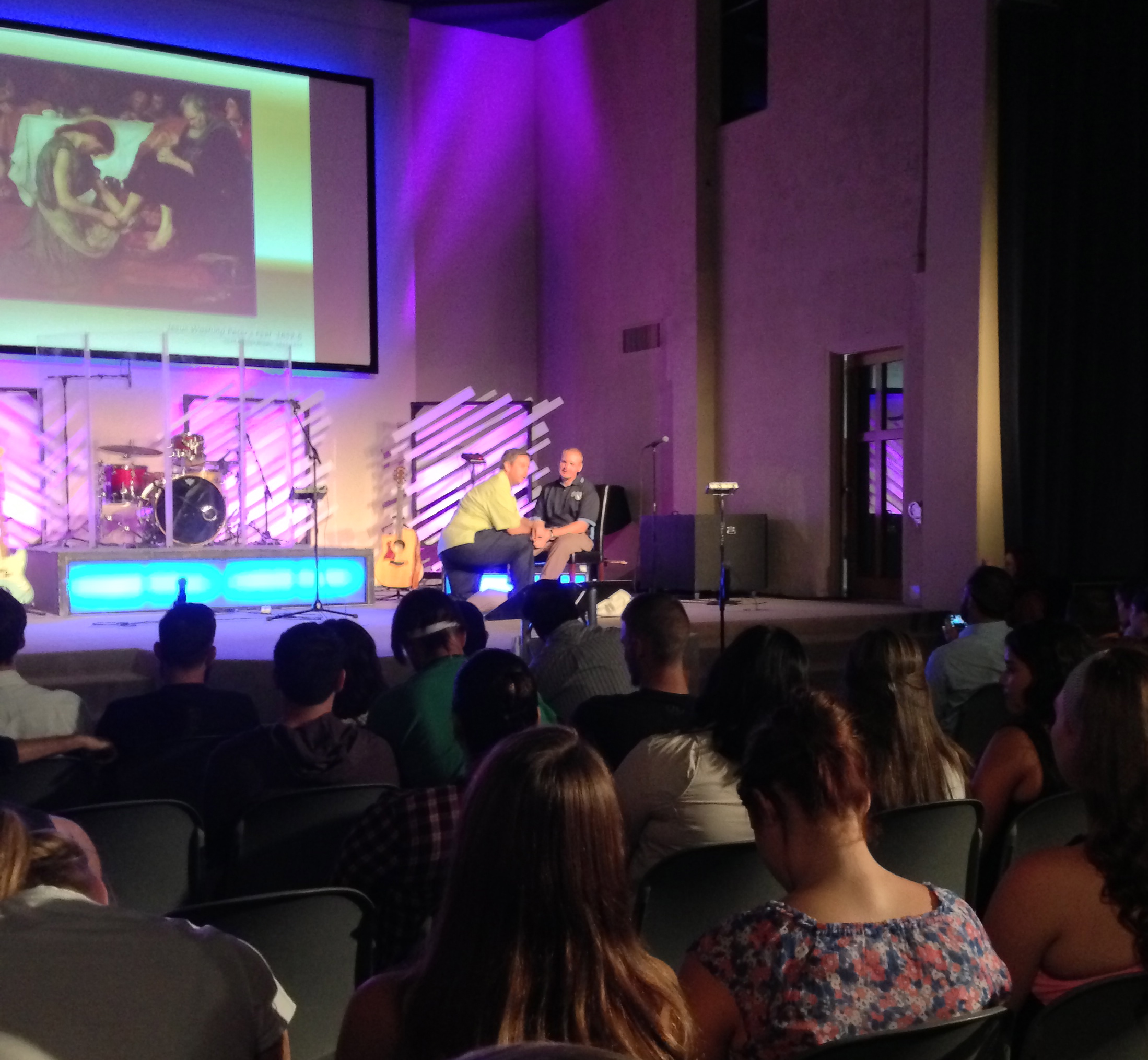Foot washing ceremony with President Dr. Paul Ague and David Jr. (representing the faculty and administration serving the students at SDCC)