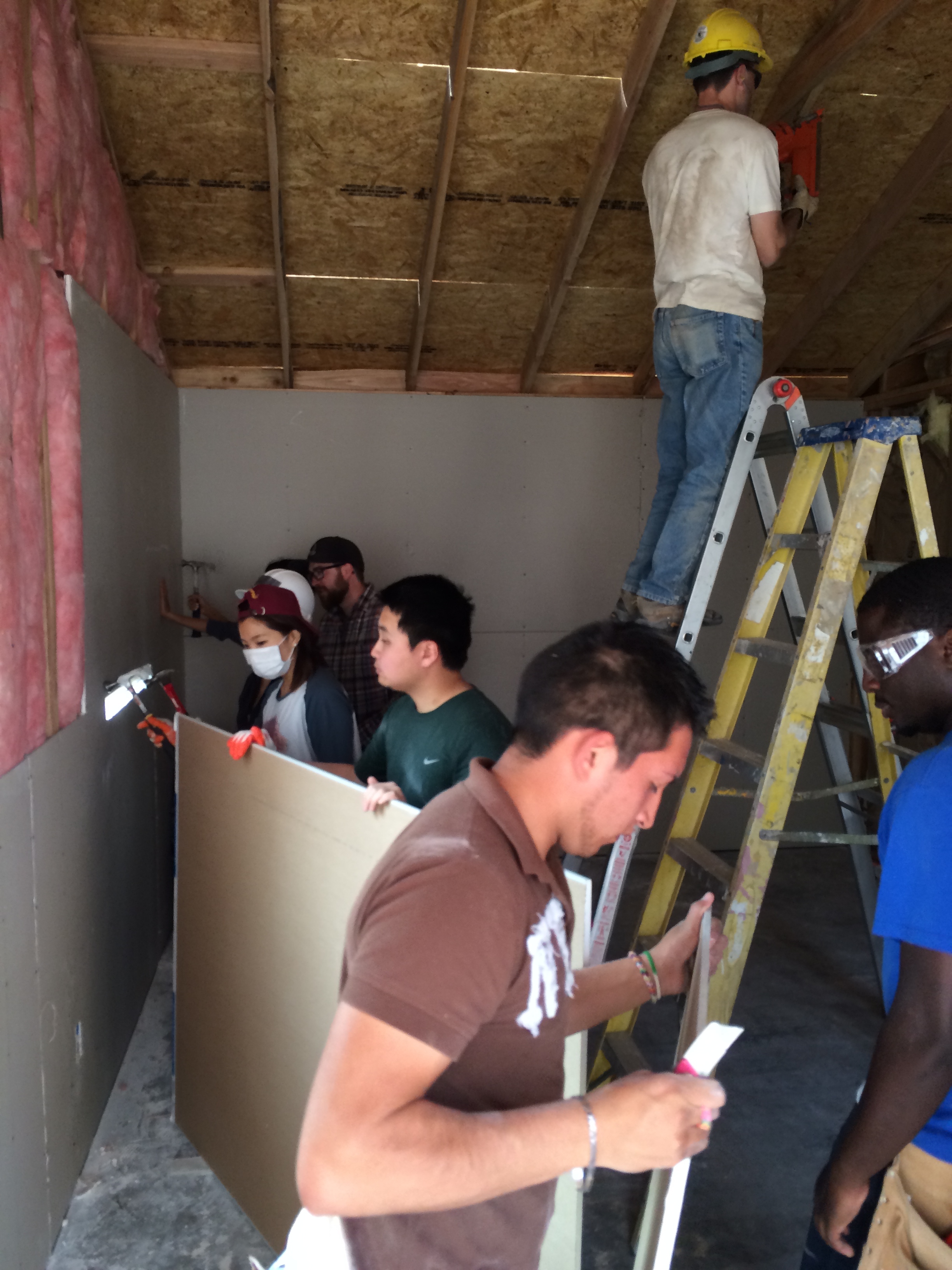 The group working hard to finish up the house