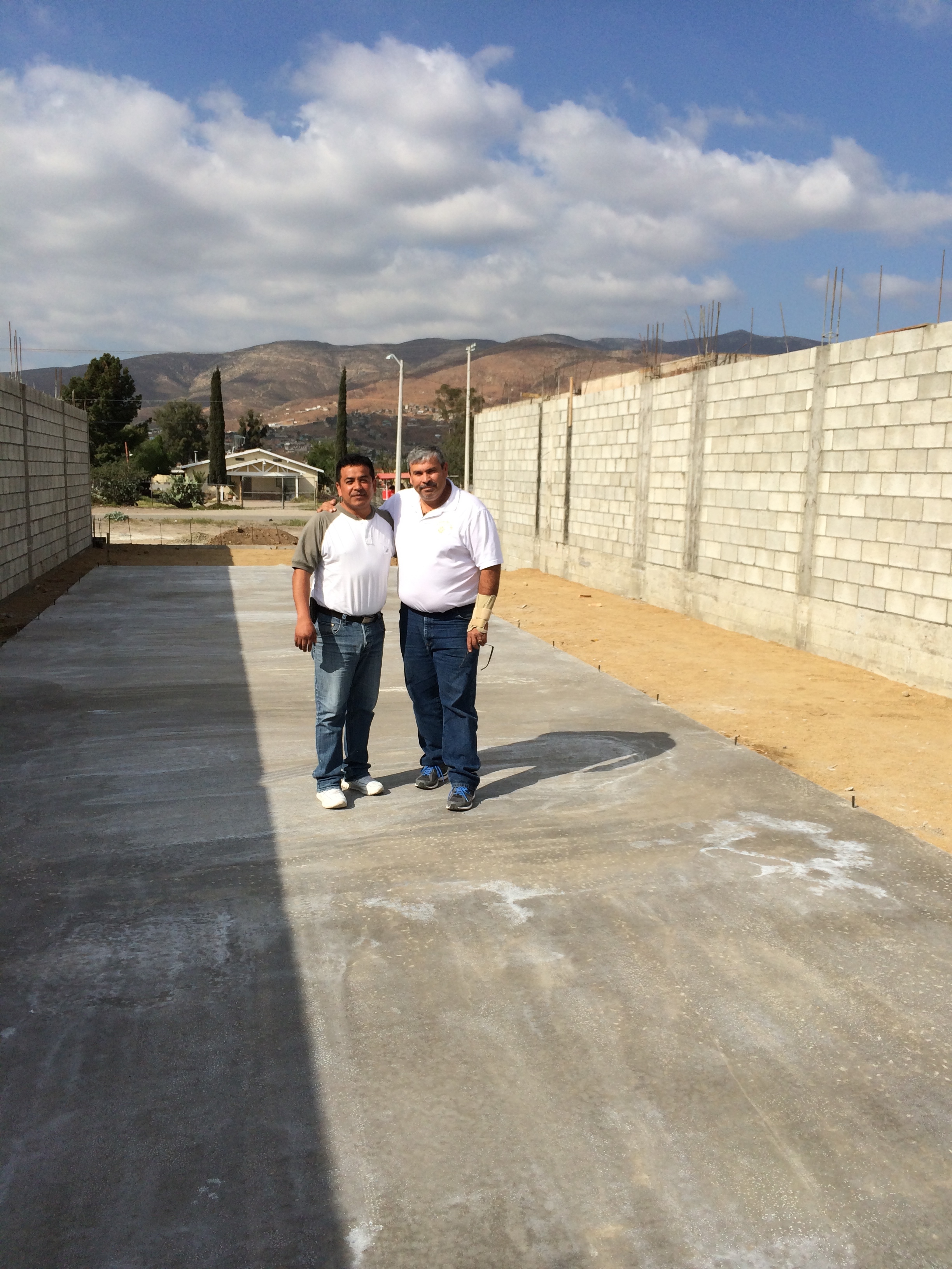 Pastor Ivan Casados with Pastor Daniel Nuñez on the new church's foundation