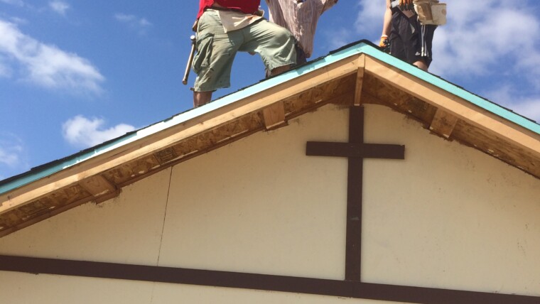 Celebrating finishing the roof on the church