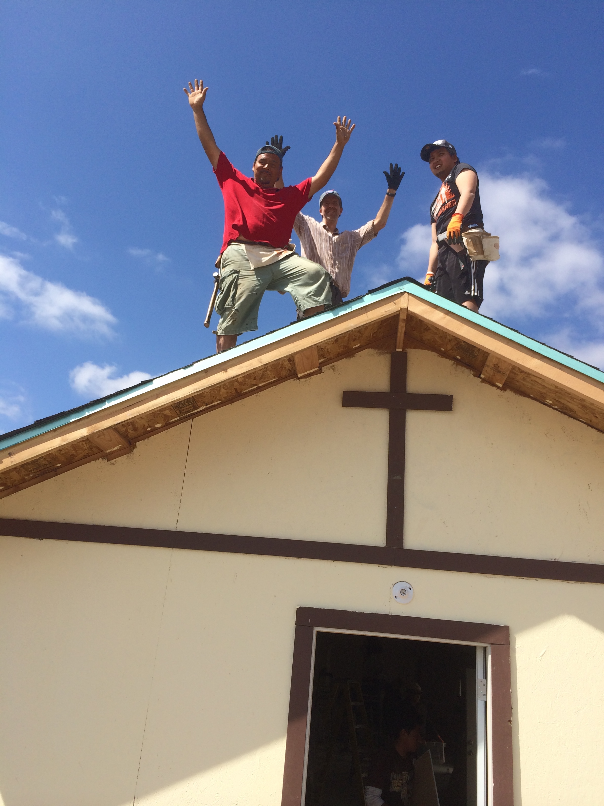 Celebrating finishing the roof on the church