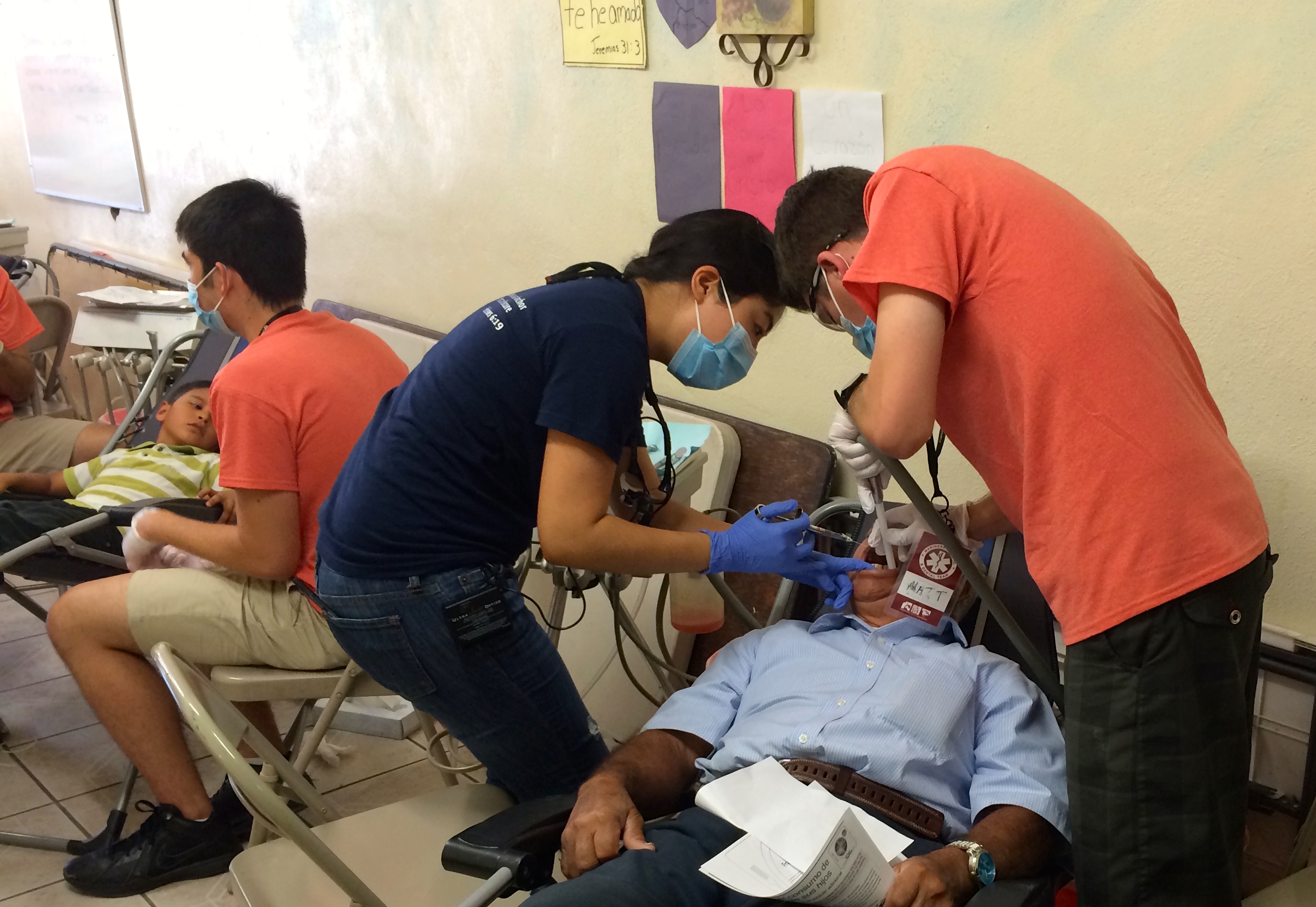 Sarah Oh, on the left, helping on the the patients