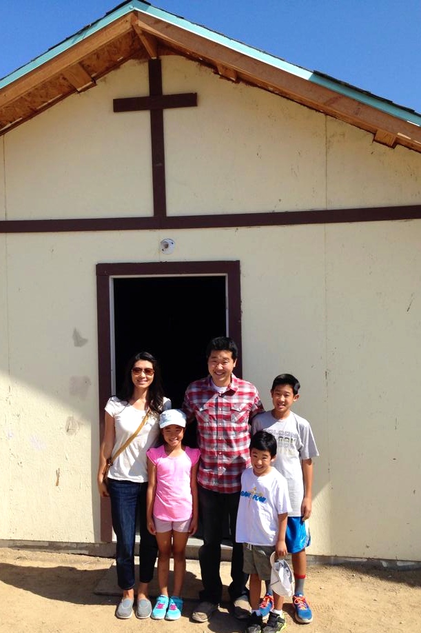 Paul and Linda Kim and family standing in front of the last church we helped build - the Lo Mejor del Trigo Church in Ribera del Bosque