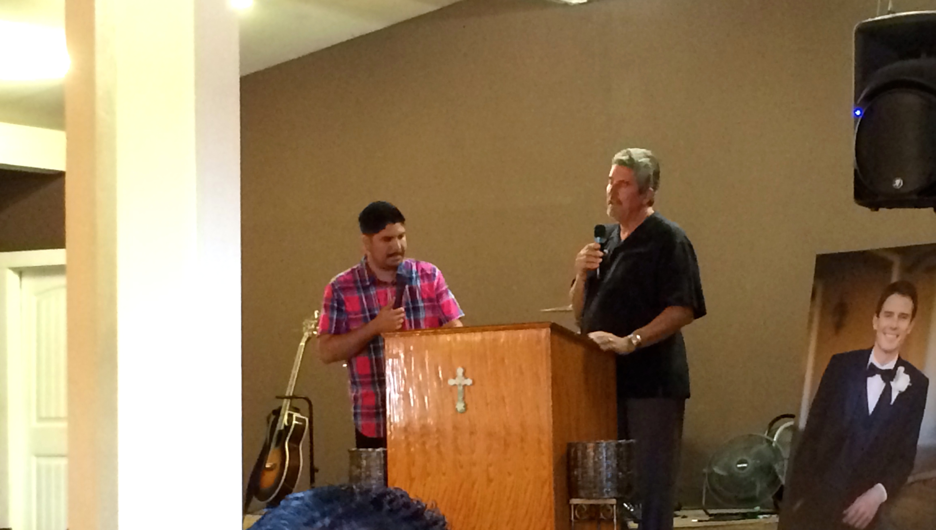 Scott Griffiths sharing at the memorial service for his son, Jacob. Turi Nuñez translated for Scott
