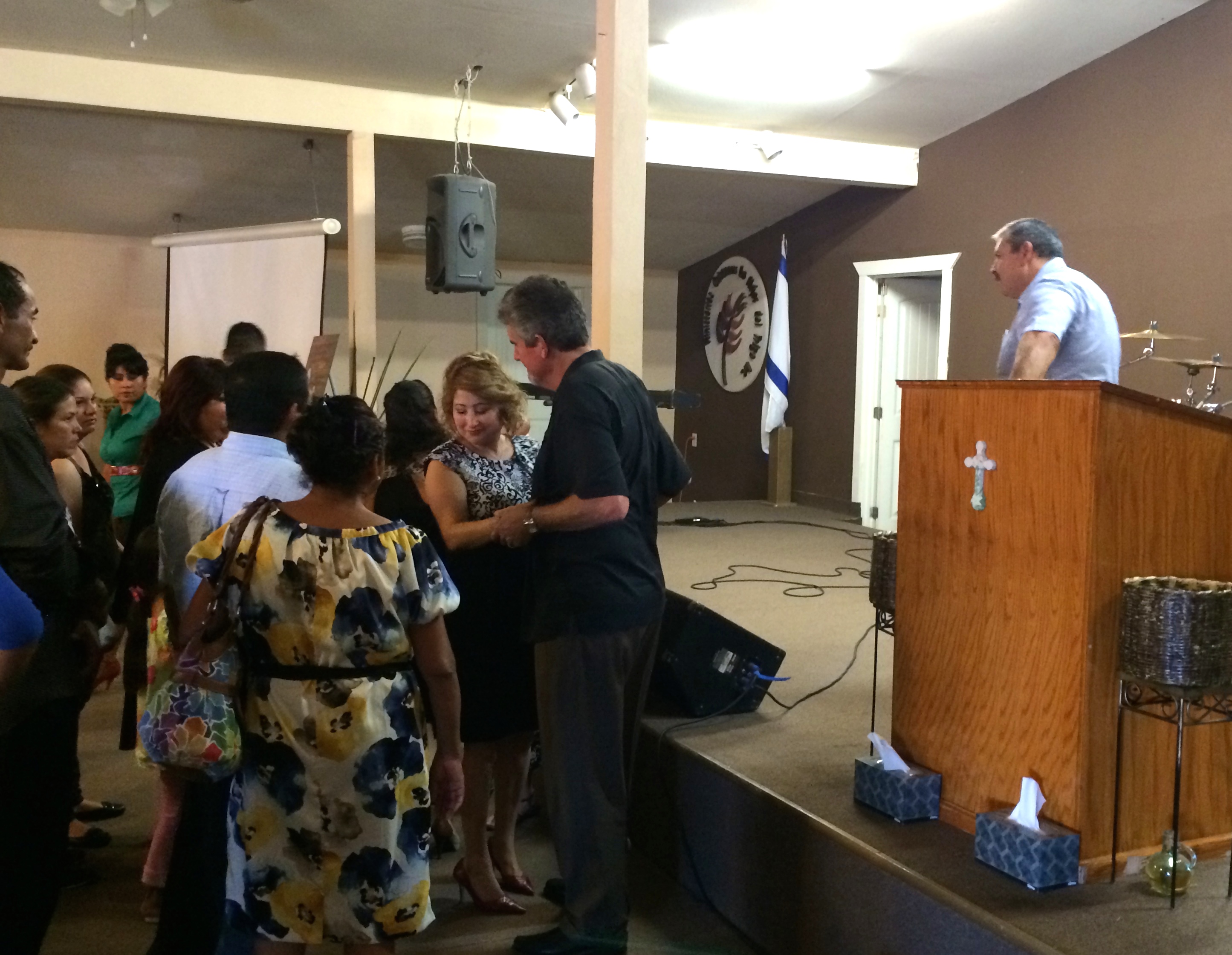 The people of Lo Mejor del Trigo comforting Scott and Susan after the service