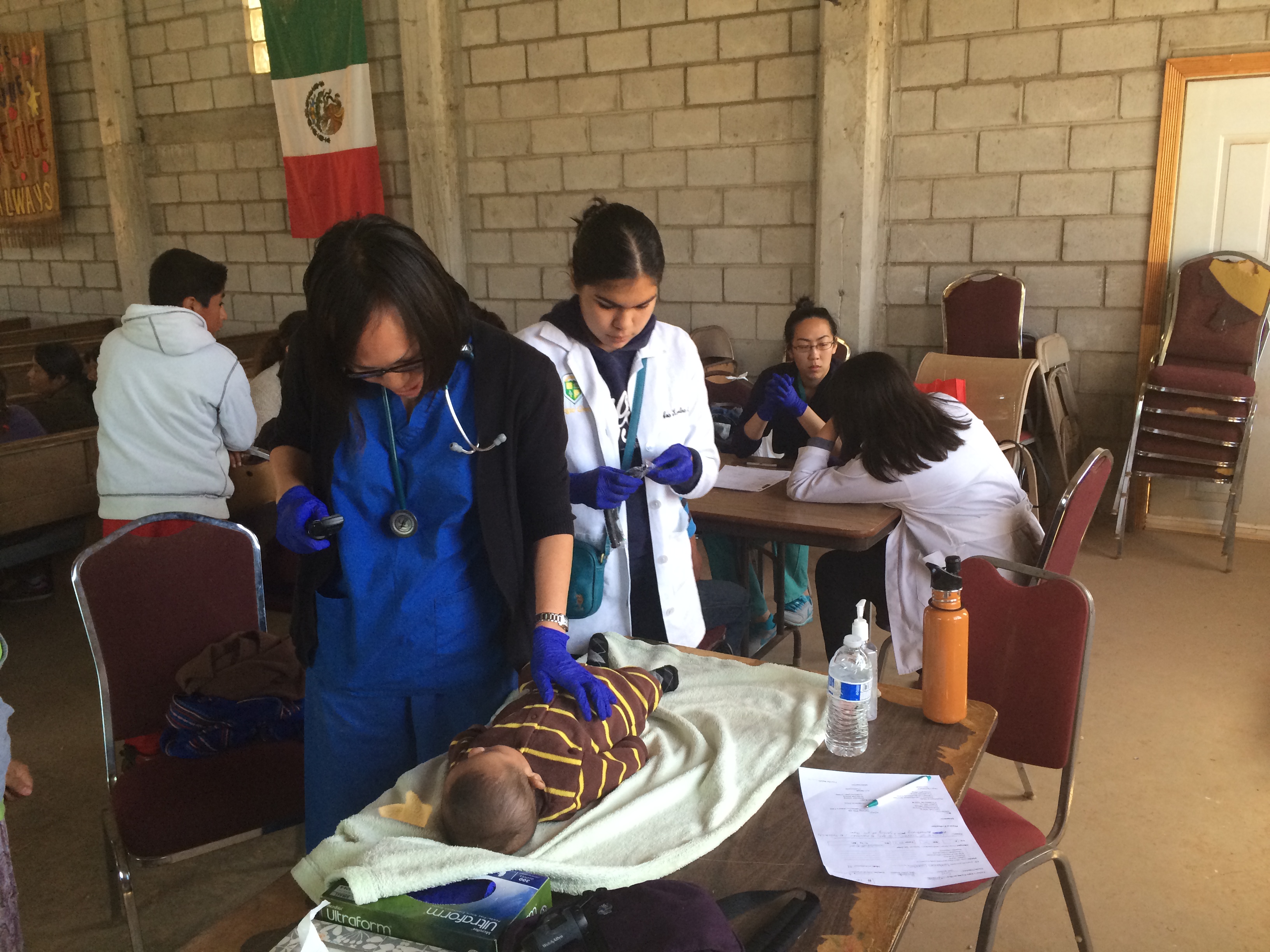 Patricia Lee lovingly caring for an infant patient