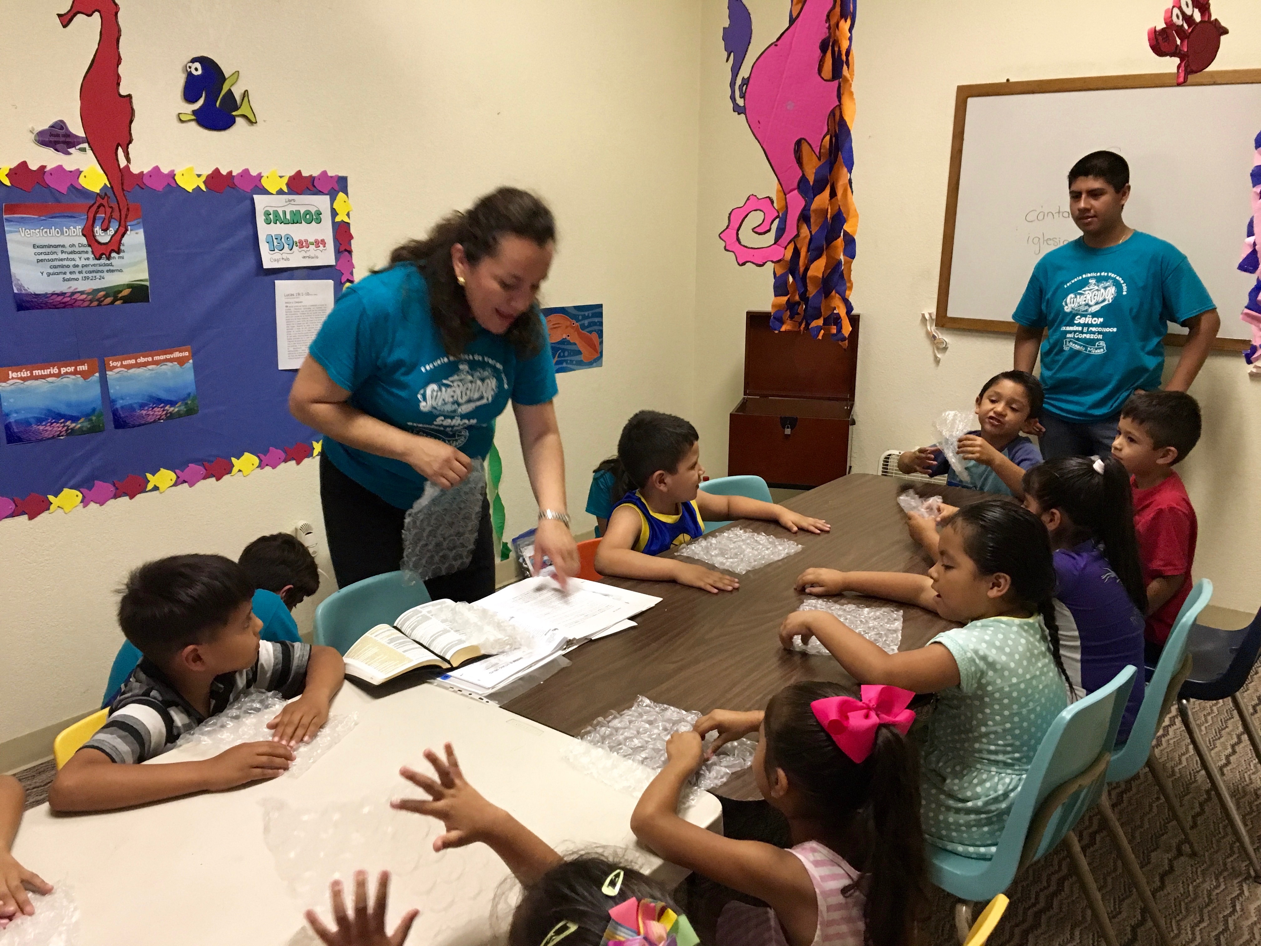 Luz teaching her group of young children