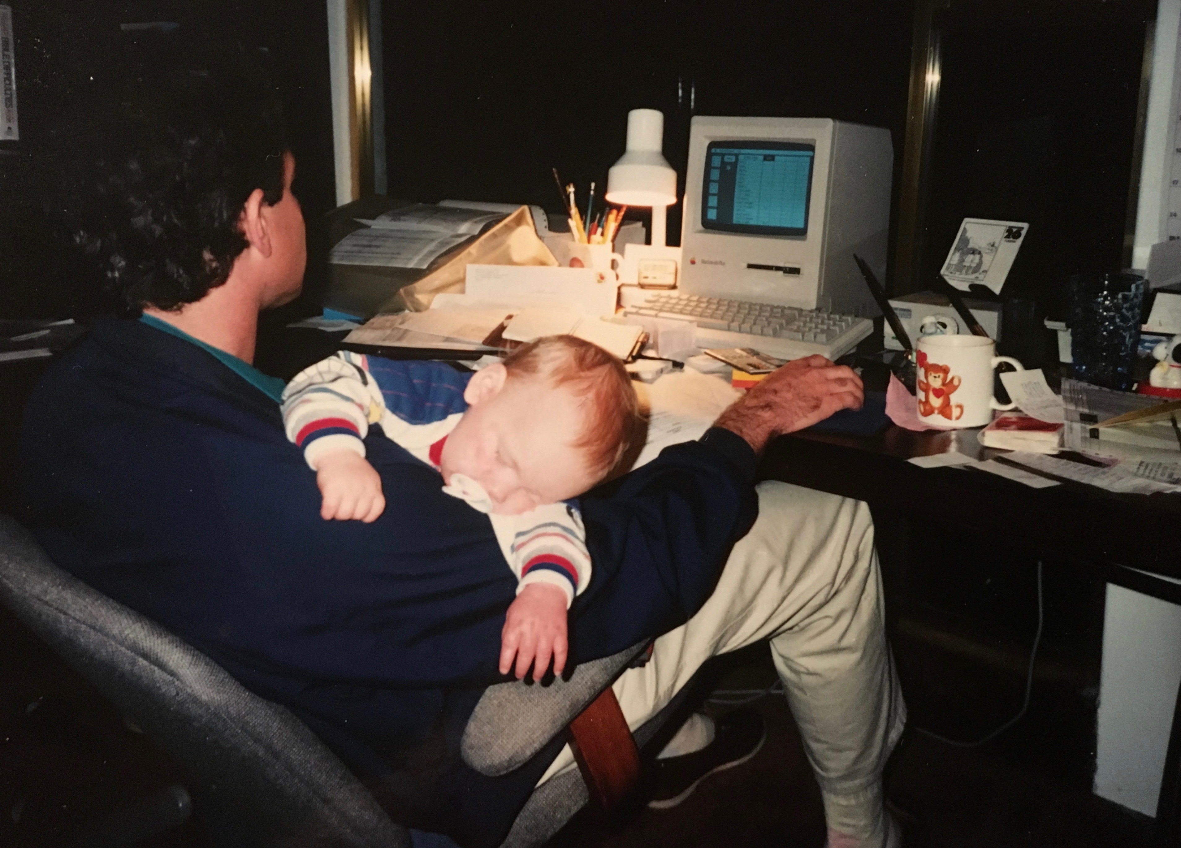 I like this shot of me working at night on my Mac with my son sleeping. The Mac dates me - it was one of the first models that came out in the late 80's.