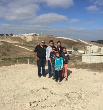 Pastor Daniel Nuñez with Pastor Obed Lares & Cesiah and their three children on the land where the church is being built