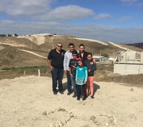 Pastor Daniel Nuñez with Pastor Obed Lares & Cesiah and their three children on the land where the church is being built