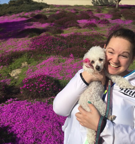 Hannah with Daisy near the flowers that bloom this time of year