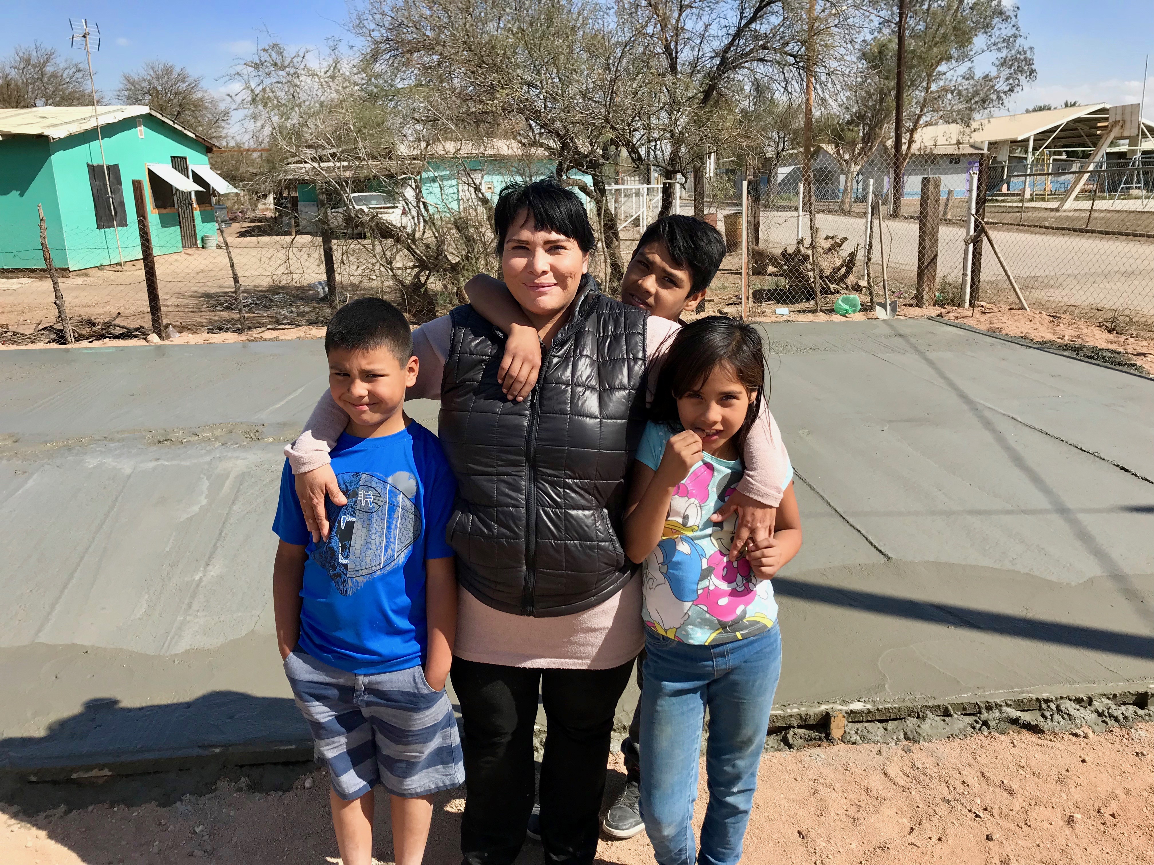Cristina with her three children - she prayed for 3 years for this church!