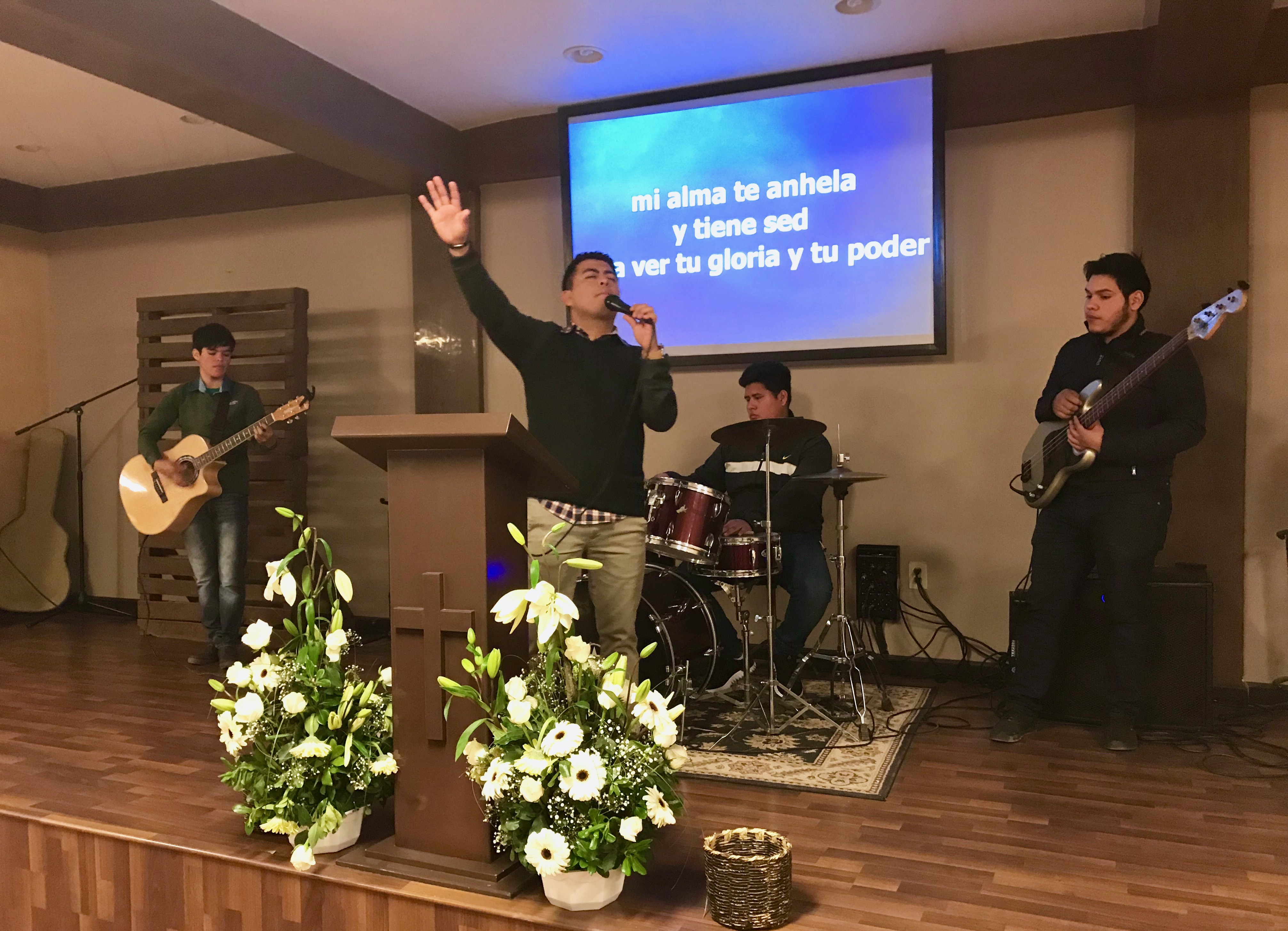 Pastor Abraham Velazquez leading worship