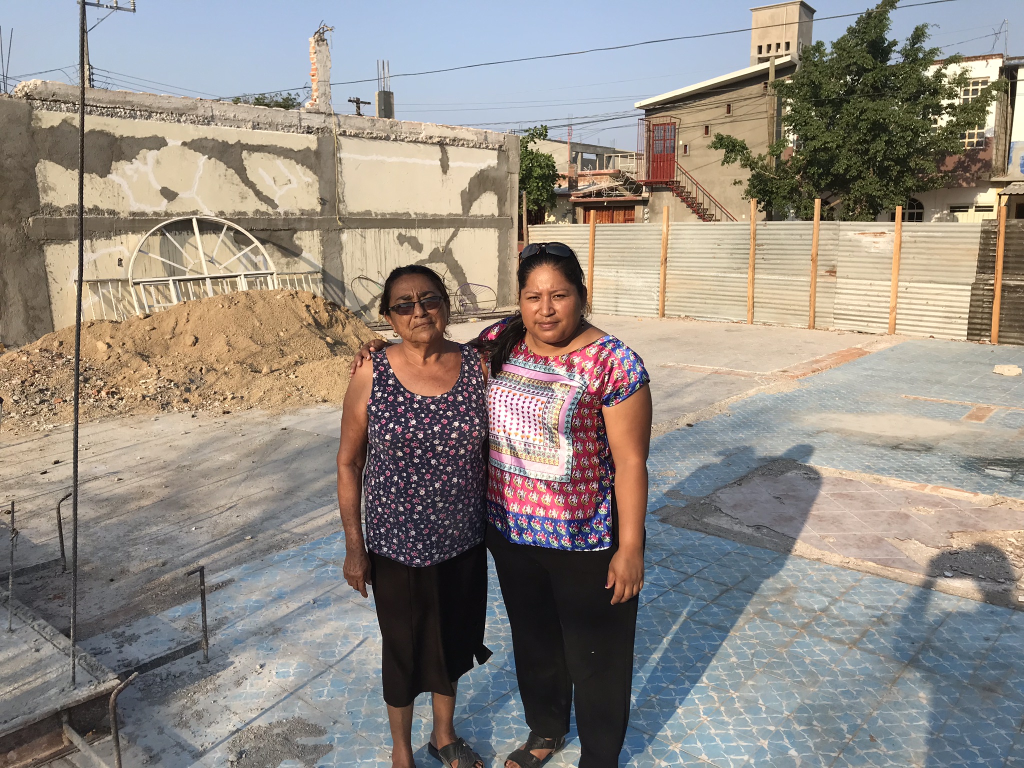These two ladies, Alicia and Laura lost their home in the Earthquake. They are standing on the foundation of what once was Laura’s home.