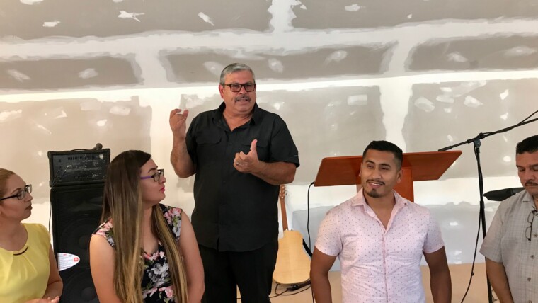 Pastor Daniel Nuñez leading us in a time of prayer and commissioning for Mere & Edna. It was a special time!