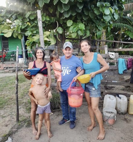 Pastor Jose sharing the love of Christ, helping a family in need