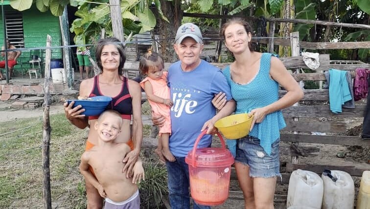 Pastor Jose sharing the love of Christ, helping a family in need