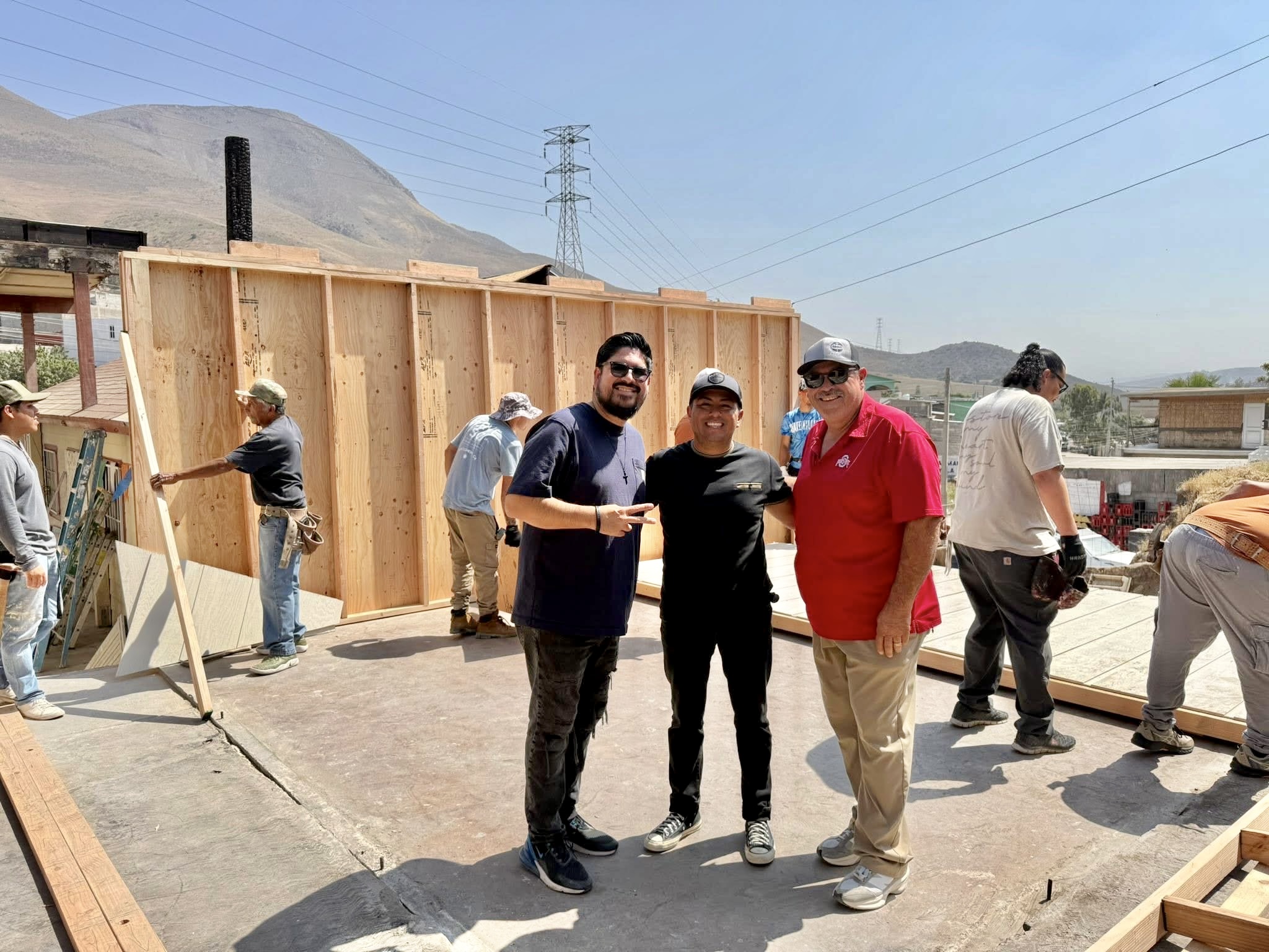 Abraham in the middle, with pastor Daniel Nunez (in the red) and Pastor Tury, at the rebuild site.