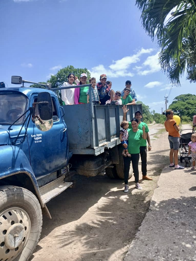 Yaima and her team arriving with the Gospel and blessing for the children.