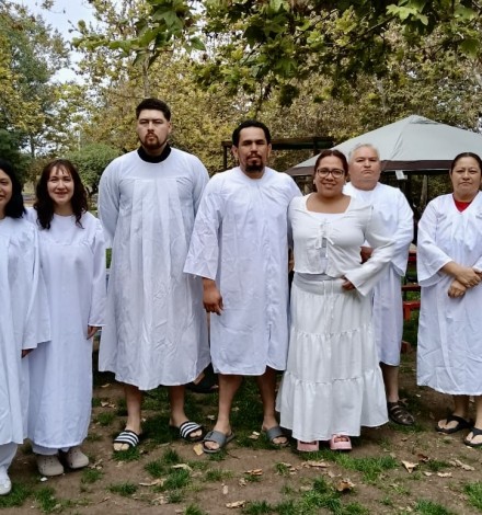 Sergio and Andrea are the couple in the middle getting baptized with the rest of their group.