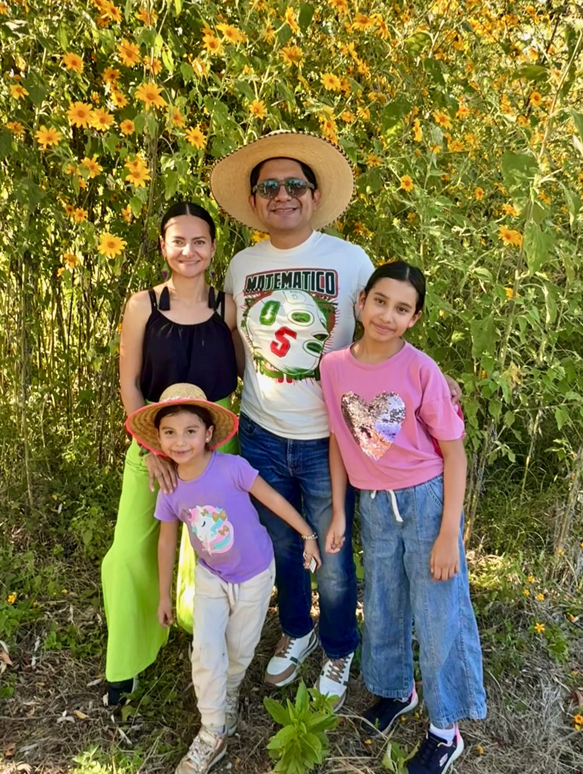 Pastor Eliel and his Wife Jessica, and their two daughers Sarvia and Tirza on their new church property.