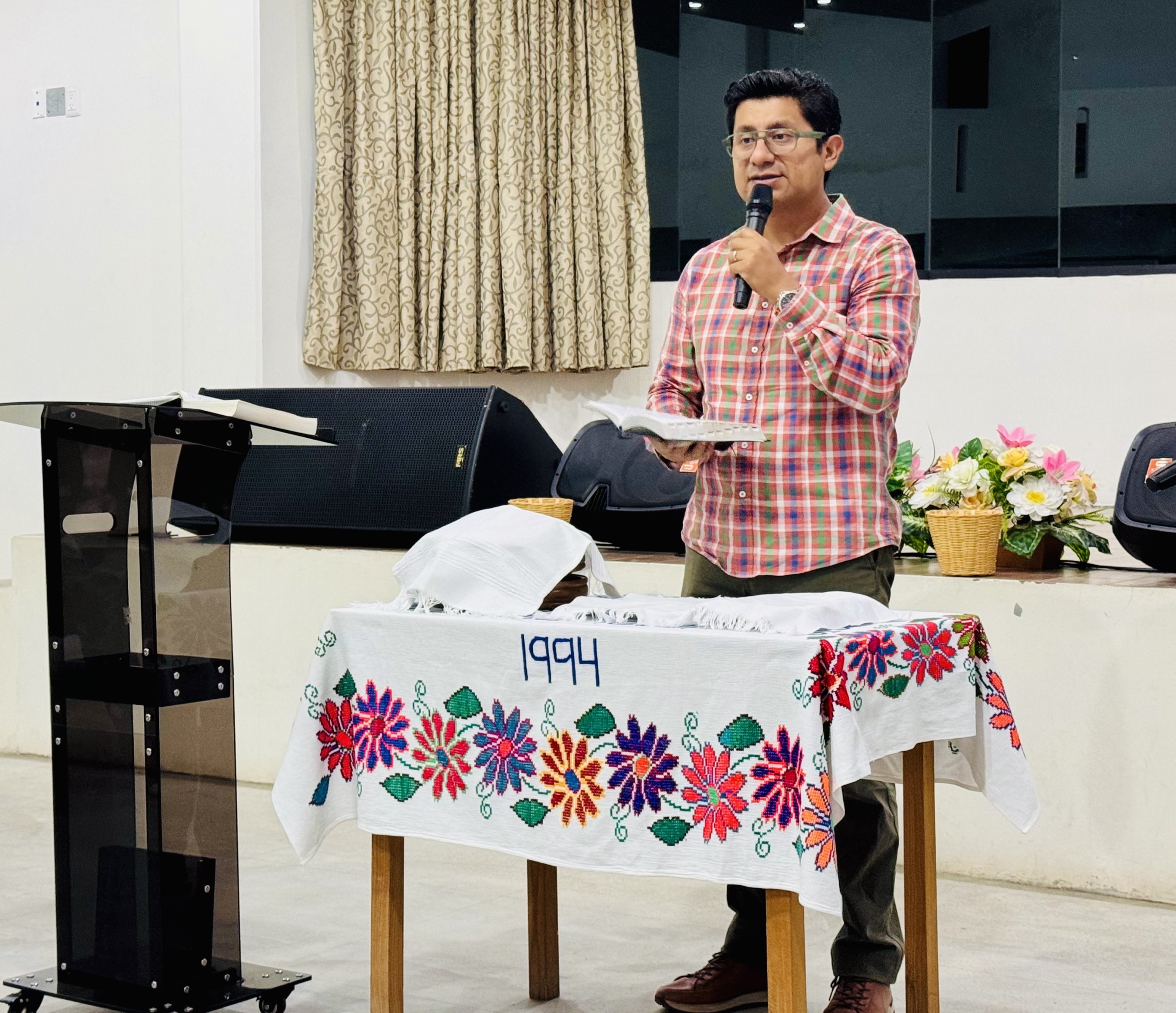 Pastor Eliel leading Communion time at their mission church which is called Betania.