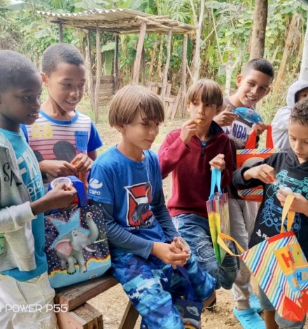 Young boys are happy to receive their toys