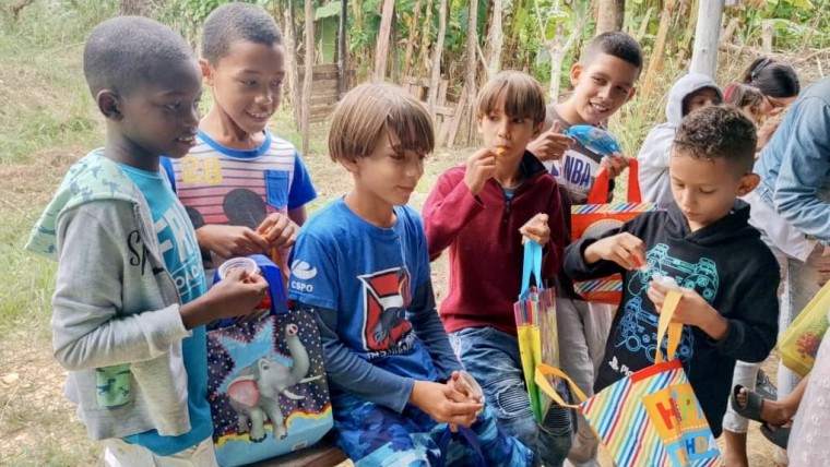 Young boys are happy to receive their toys