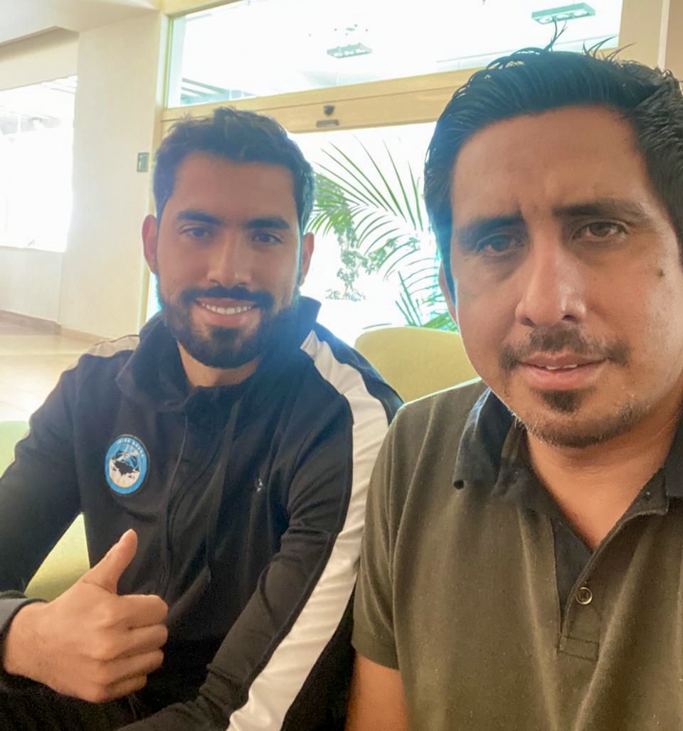Pastor Noe Reyes with professional soccer player Joel Garcia.