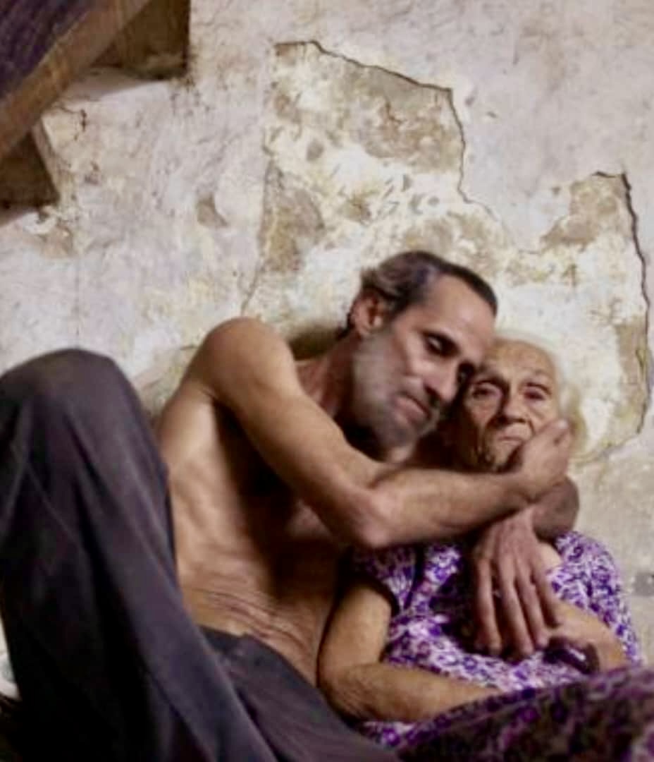 Picture of a Son and Mother in the midst of survival.