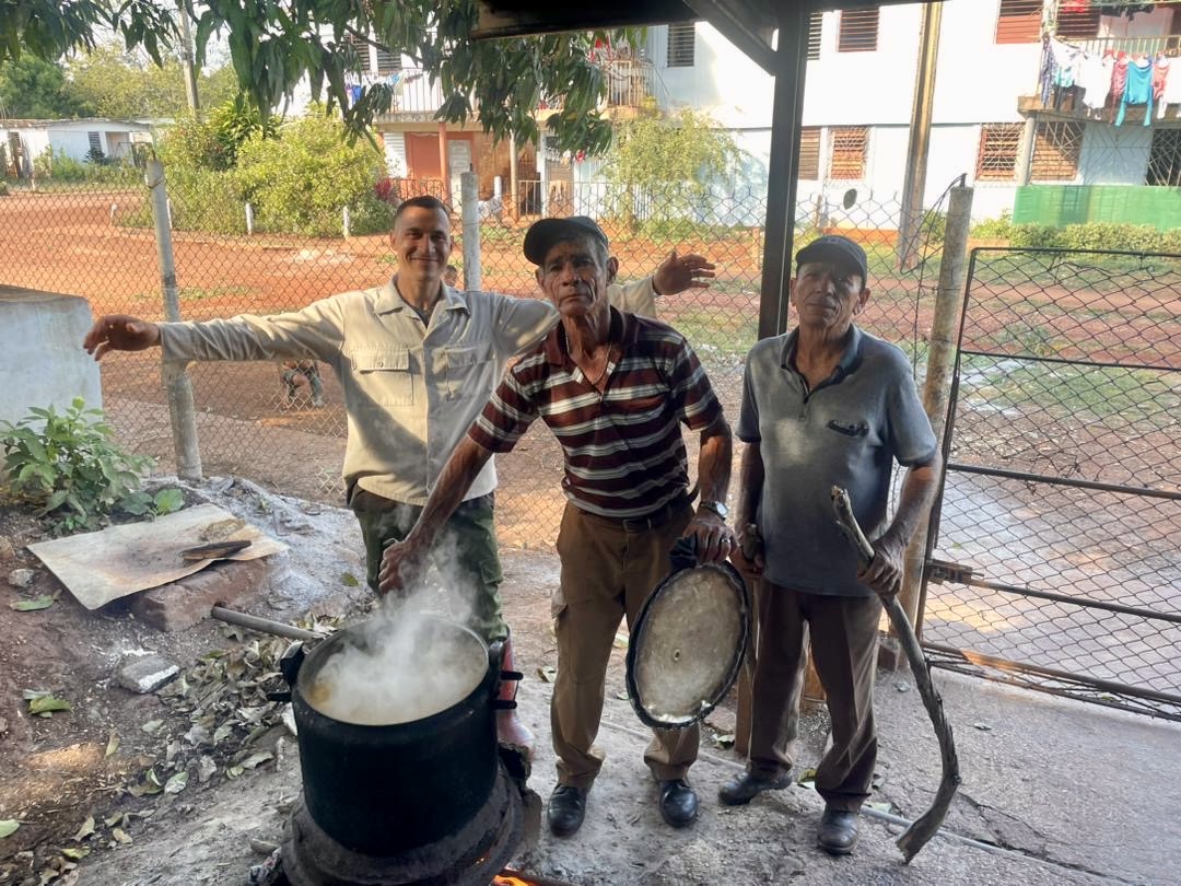 Our familia cooking a meal to share with the congregation