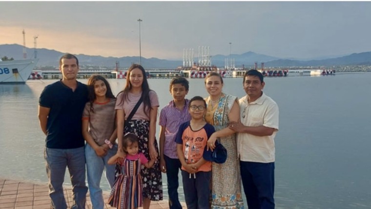 Pastor Jose Luis and his wife Mariel, with his two boys Josafat, and Asaf and a family from their new church.