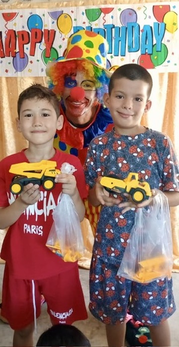 Children being blessed by Hannah's Toys of Hope