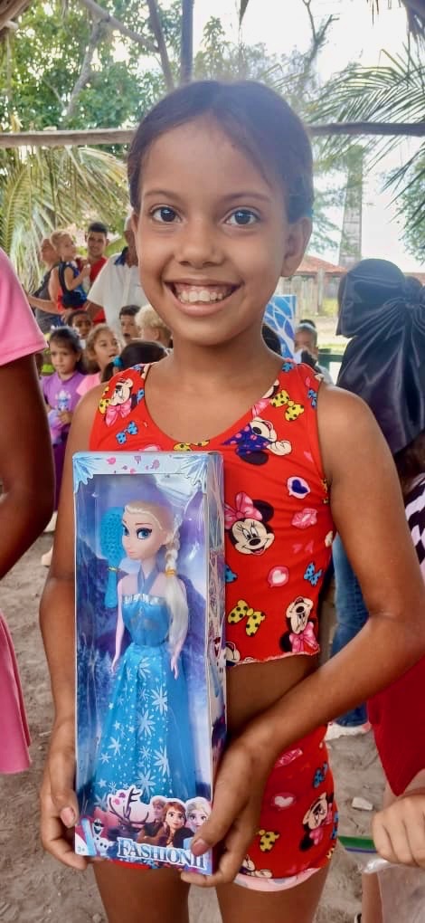 The joyful faces of children receiving toys through Hannah’s Toys of Hope.