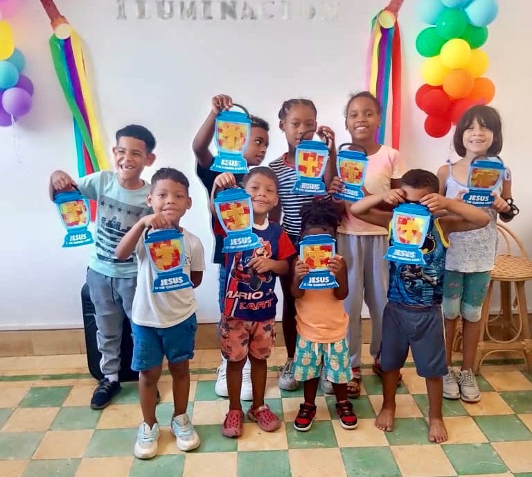Happy children learning about Jesus during their VBS class.
