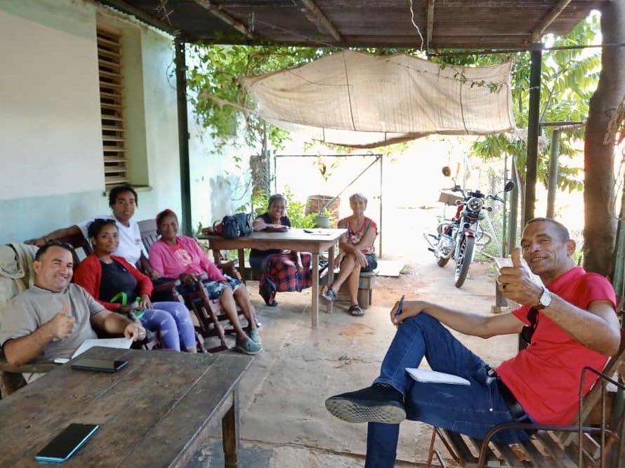 Pastor Dunesky in the red shirt on the right with some of the people from his church